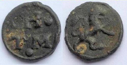 A cast lead token from London (c.1610 to 1650) depicting the initials of its issuers on the obverse and a lion rampant on its reverse.